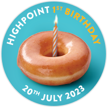 A single Original Glazed Doughnut with a candle in the middle to signify the Highpoint Store's first Birthday, celebrating a year in this location